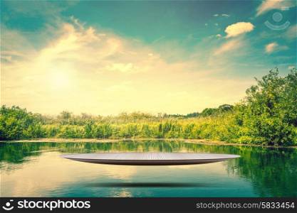 Futuristic metal stage hovering over a idyllic lake
