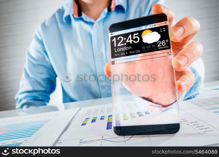 Futuristic Smart phone (copy space display) with a transparent display in human hands. Concept actual future innovative ideas and best technologies humanity.