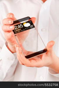 Futuristic Smart phone (copy space display) with a transparent display in human hands. Concept actual future innovative ideas and best technologies humanity.