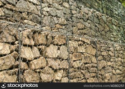 Gabion plastic covered wire mesh baskets filled with stone for slope stabilization