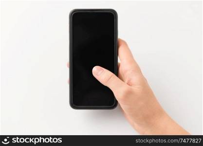 gadget and technology concept - close up of hand with black smartphone. close up of hand with black smartphone