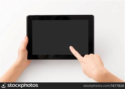 gadget and technology concept - close up of hands with black tablet computer smartphone. close up of hands with black tablet computer