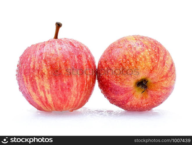 gala apples with drops of water on white background