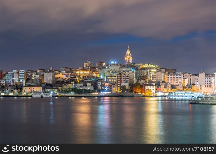Galata Tower at night with Istanbul city in Istanbul, Turkey.