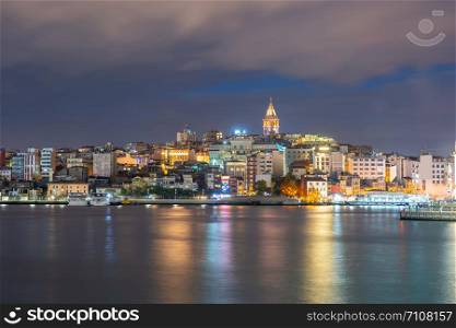 Galata Tower at night with Istanbul city in Istanbul, Turkey.