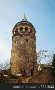 Galata Tower (Christea Turris) in Istanbul, Turkey on a sunny day