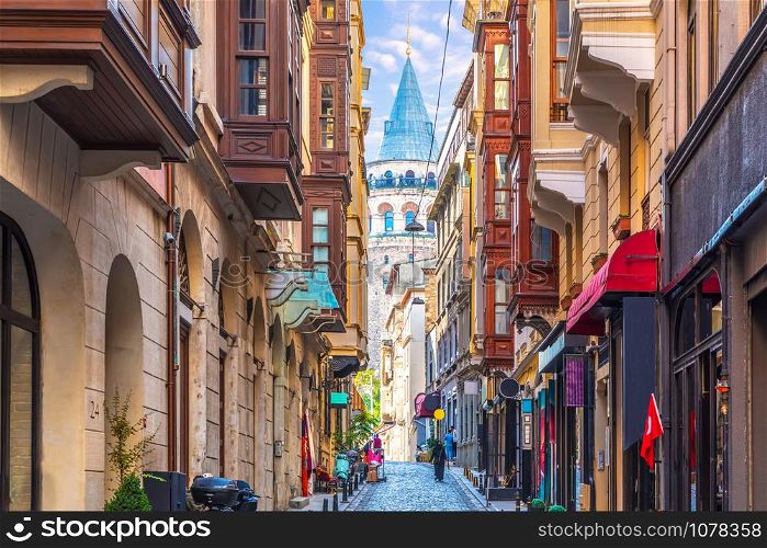 Galata Tower in Istanbul, view from the narrow street.. Galata Tower in Istanbul, view from the narrow street