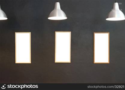 gallery interior, empty picture frames on the wall with lighting