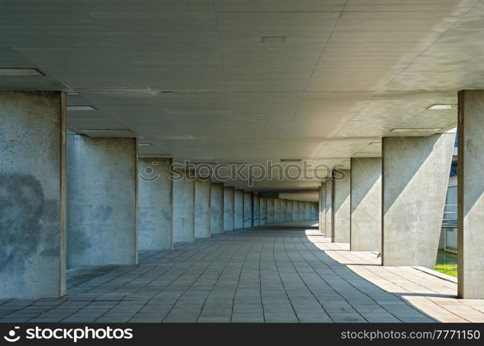 Gallery tunnel rainbow passage under NAI building, Nederlands Architecture Institute near Museum Park, Rotterdam, The Netherlands in day without illumination. Ggallery tunnel near Museum Park, Rotterdam, The Netherlands