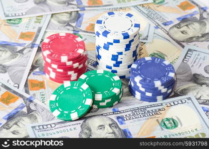 Gambling chips and heap of dollars