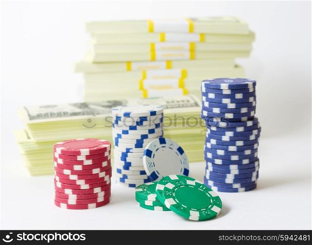Gambling chips dices and heap of dollars isolated