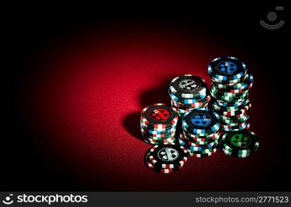 gambling chips on the red background