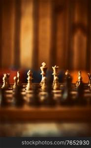 Game of Chess. Checkerboard with Figures on it in Soft Warm Room Light. Intellectual Sports. Intellectual Games.