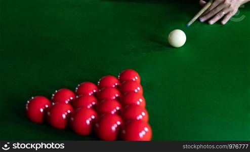 Game snooker billiards or opening frame player ready for the ball shot, athlete man kick cue on the green table in bar