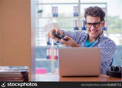 Gamer addict playing computer games at home