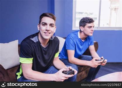 gamers with gamepad couch