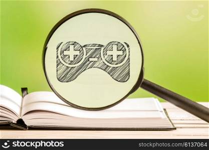Games search with a pencil drawing of a gamepad controller icon in a magnifying glass