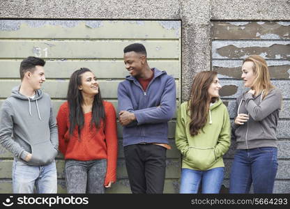 Gang Of Teenagers Hanging Out In Urban Environment