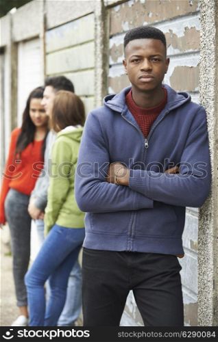 Gang Of Teenagers Hanging Out In Urban Environment