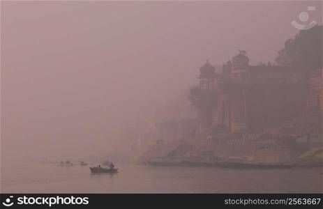 Ganges River waterfront in mist, Varanasi, Uttar Pradesh State, India