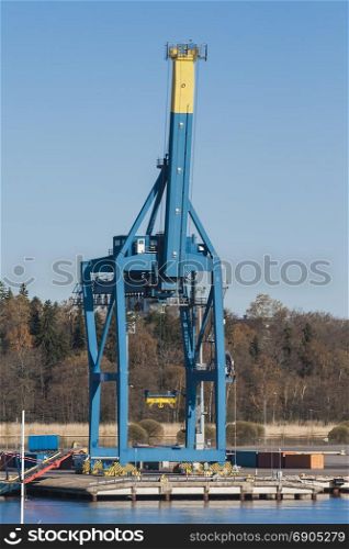Gantry crane on the dock port is idle with raised boom
