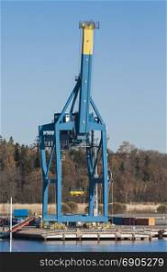 Gantry crane on the dock port is idle with raised boom