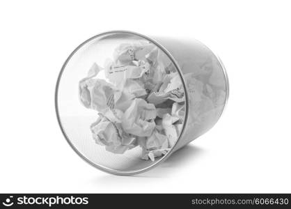 Garbage bin with paper waste isolated on white