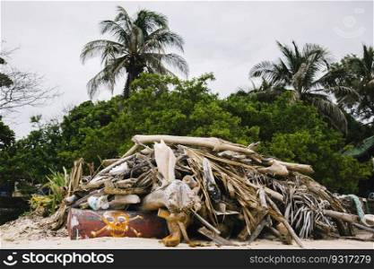 Garbage on the tropical beach as environmental pollution concept