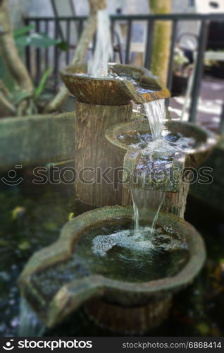 Garden decorated with vintage fountain, stock photo