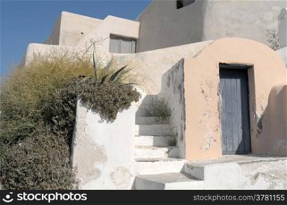 Garden en house in Thira on Santorini in Greece.