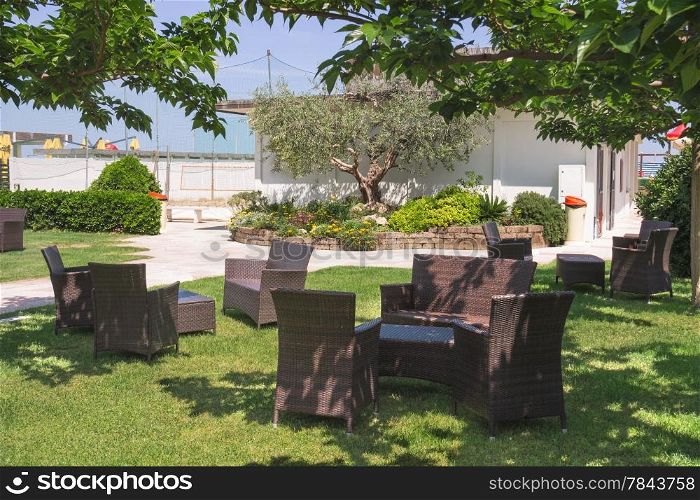 Garden furniture on lawn in courtyard a hotel spa
