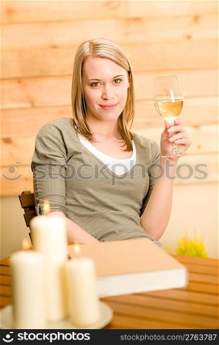 Garden happy woman enjoy glass of wine sitting on terrace