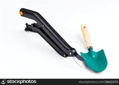 garden secateurs and shovel isolated on a white background