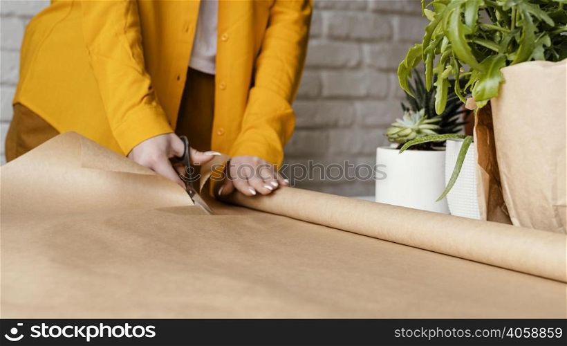 gardener cutting some wrapping paper