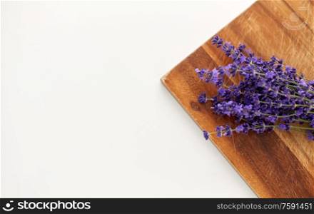 gardening, ethnoscience and organic concept - bunch of lavender flowers on wooden board. bunch of lavender flowers on wooden board