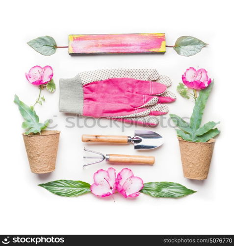 Gardening flat lay with pink flowers, pots and gardening tools on white background, top view