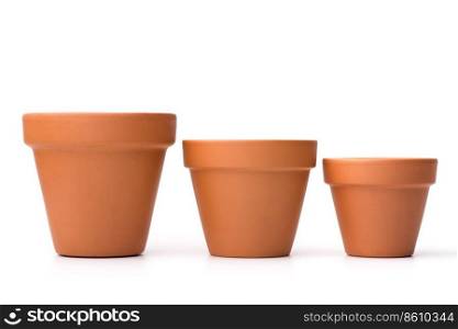 Gardening: group of empty ceramic flower pots, isolated on white background. Empty ceramic flower pots