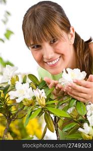 Gardening - Portrait of woman with Rhododendron flower on white background
