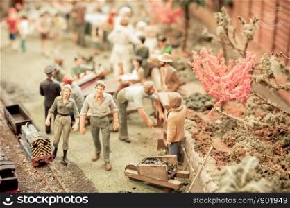 gardening scene using miniature model figures and objects