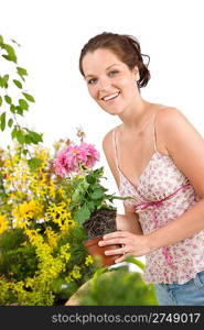 Gardening - smiling woman holding flower pot on white background