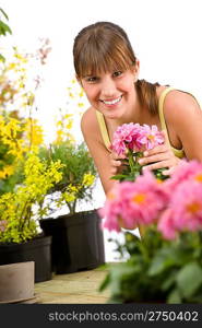 Gardening - smiling woman with flower on white background