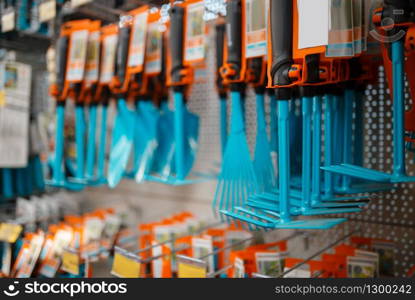 Gardening tools assortment on the showcase, shop for floristry, nobody. Equipment variation in store for floriculture, florist instrument choice