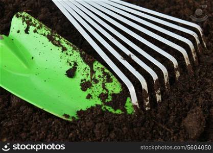 Gardening tools on organic soil