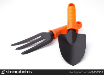 Gardening  trowel and digging fork, isolated on white background. Trowel and digging fork