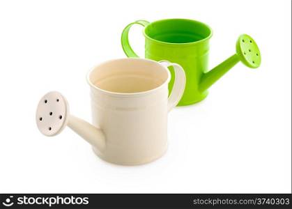 Gardening: white and green watering cans, isolated on white background