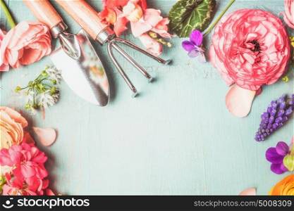 Gardening Workspace with flowers and tools on vintage shabby chic background, top view, copy space, summer planting concept