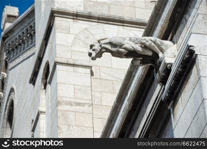 Gargoyle statue on Basilica Coeur Sacre on Montmartre in Paris 