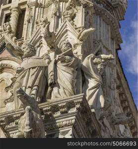 Gargoyles and Saints on facade of Siena Cathedral, Siena, Tuscany, Italy