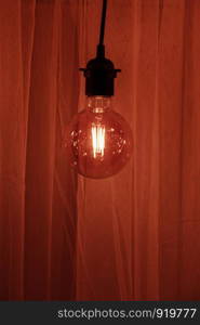 Garland Light Bulb. Light bulb on a dark background. Space for your task or message.. Light bulb on a dark background. Space for your task or message. Garland Light Bulb