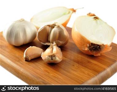 garlic and onion on a cutting board